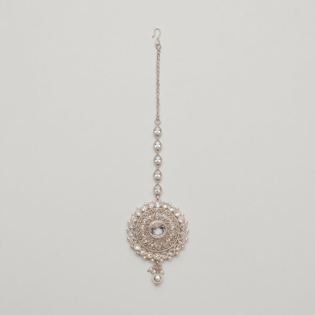 Mandala Crystal Tikka silver maang tikka with mandala round pendant clear crystals and pearl border on gray background