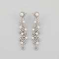 Bela Pearl Earrings silver-tone pearl vine drop earrings with marquise crystal leaves on gray background