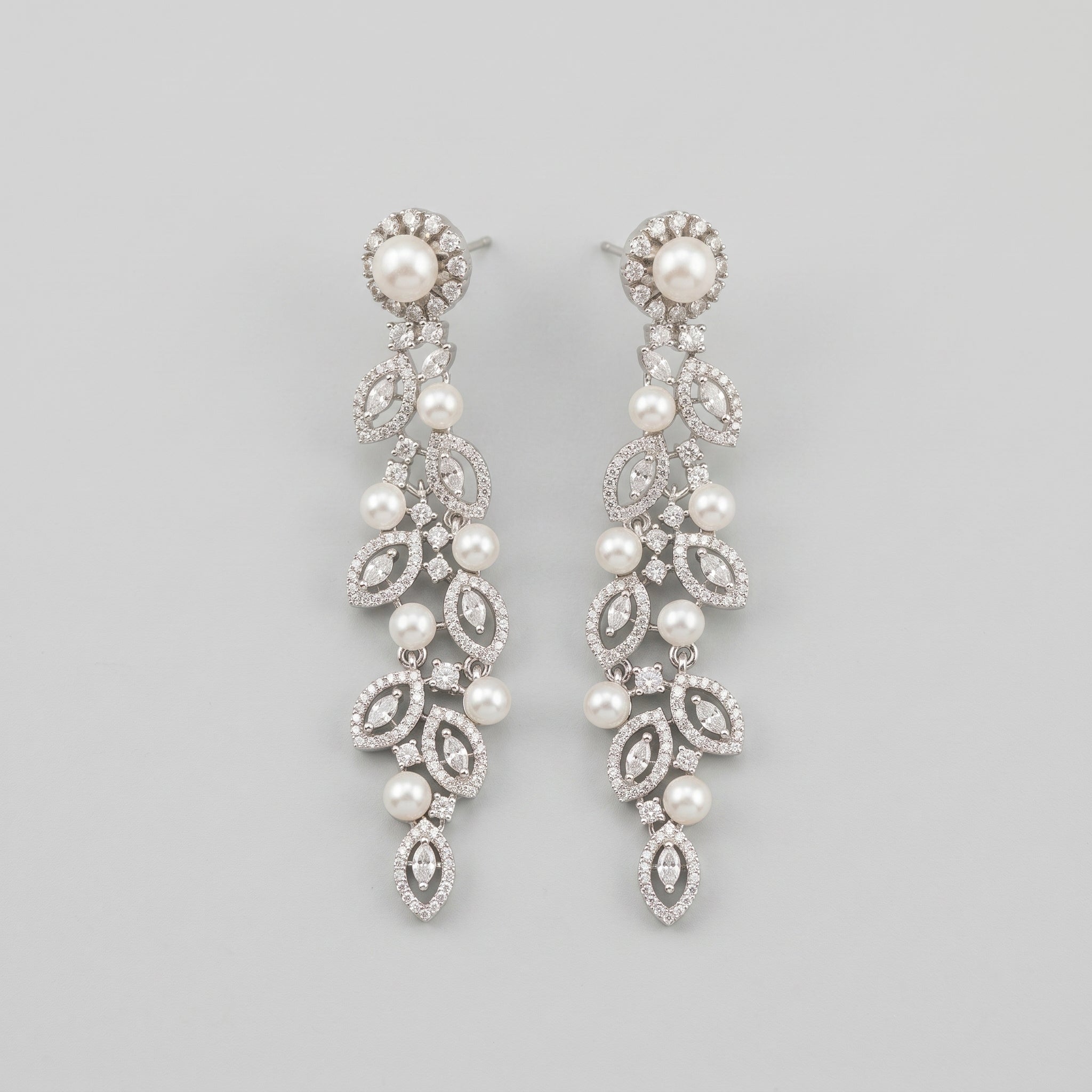 Bela Pearl Earrings silver-tone pearl vine drop earrings with marquise crystal leaves on gray background