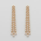 Hira Stream Earrings gold-tone crystal waterfall chandelier earrings with pear teardrop drops on gray background