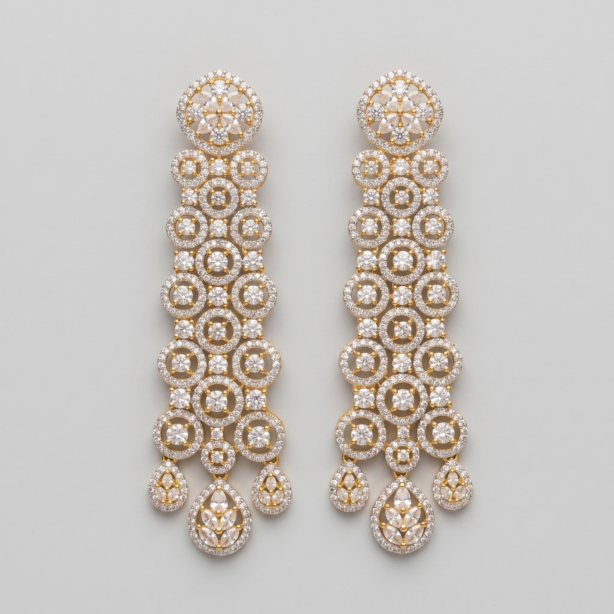 Rani Cascade Earrings long gold-tone crystal circle chandelier drops on gray background