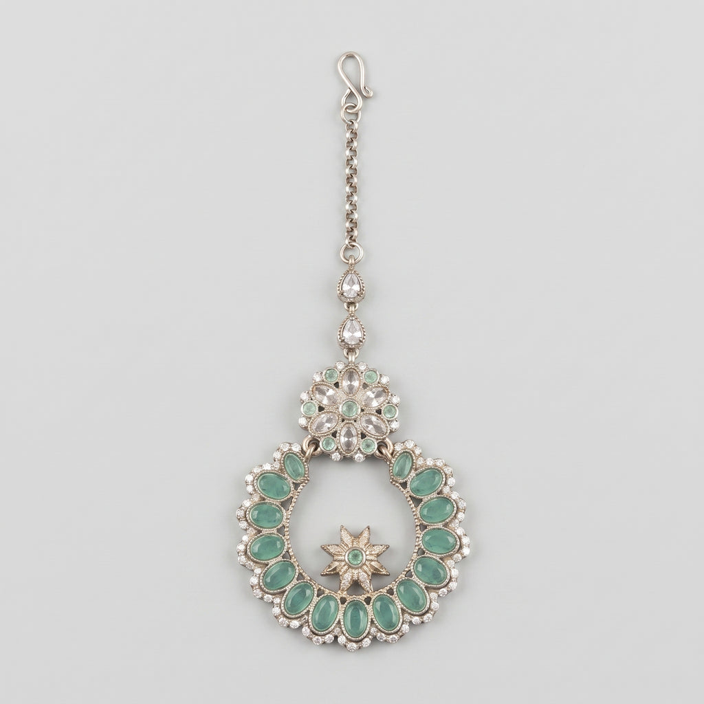 Aqua Star Tikka silver maang tikka with mint green wreath pendant on gray background