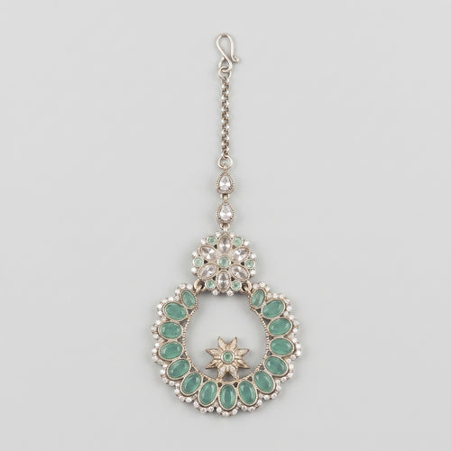Aqua Star Tikka silver maang tikka with mint green wreath pendant on gray background
