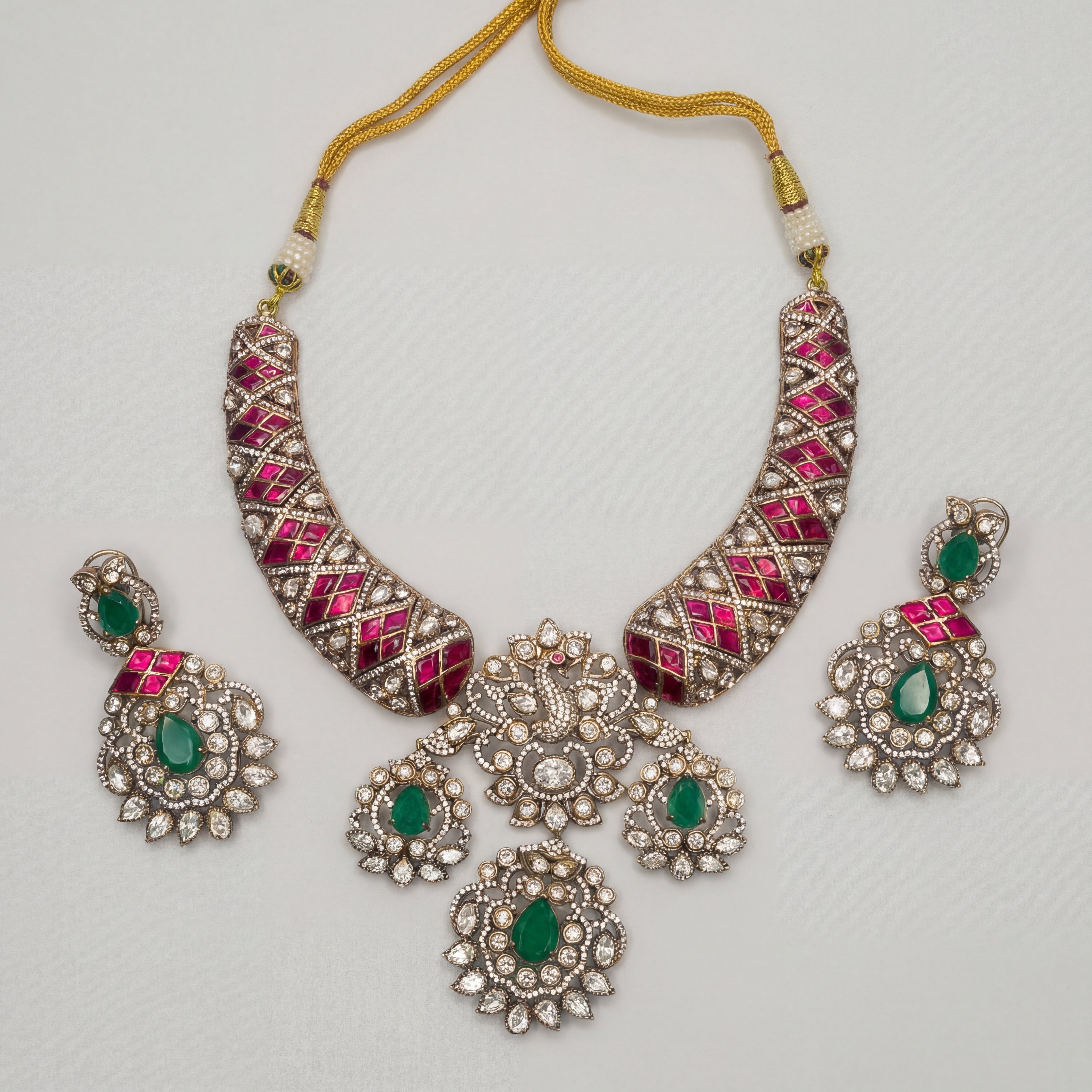 Meena Emerald Necklace Set silver collar with peacock motif, pink and green stones, and earrings