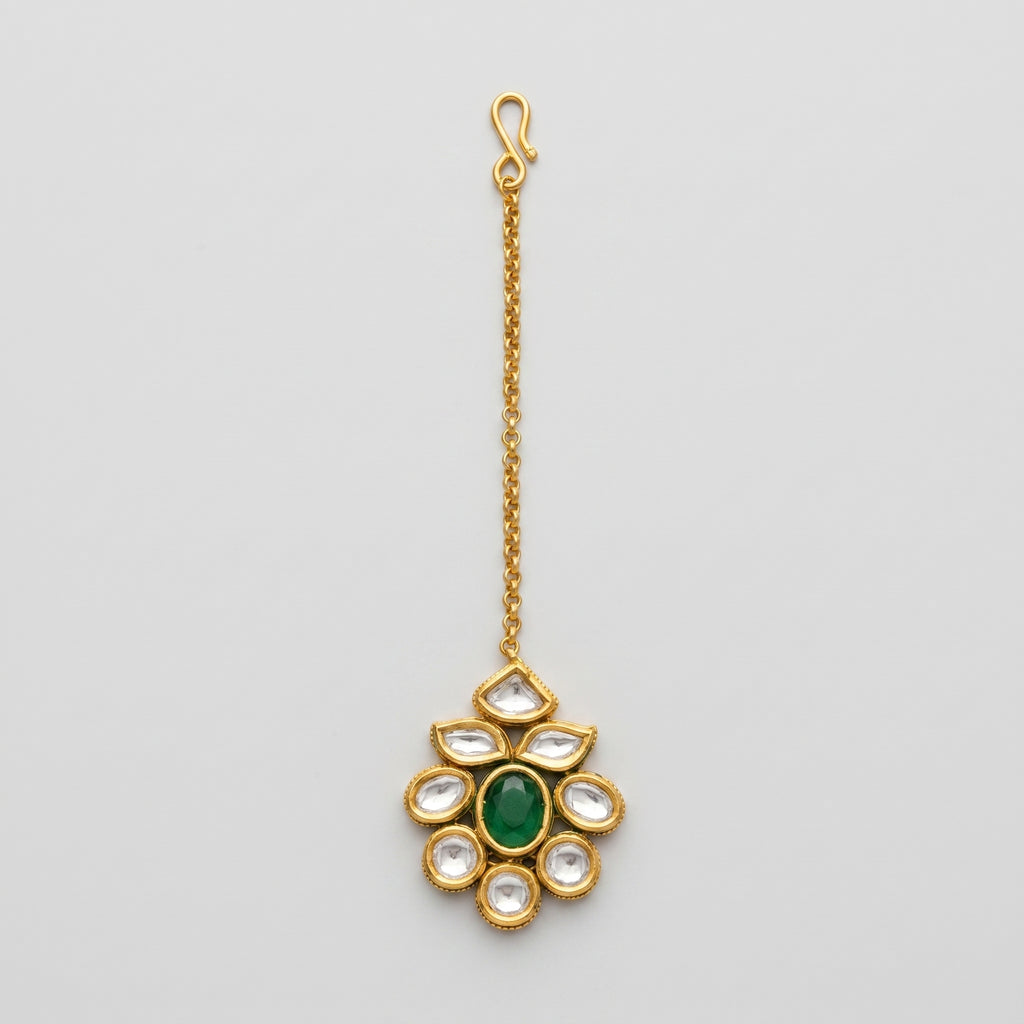 Panna Jadau Tikka gold jadau maang tikka with green center stone on gray background