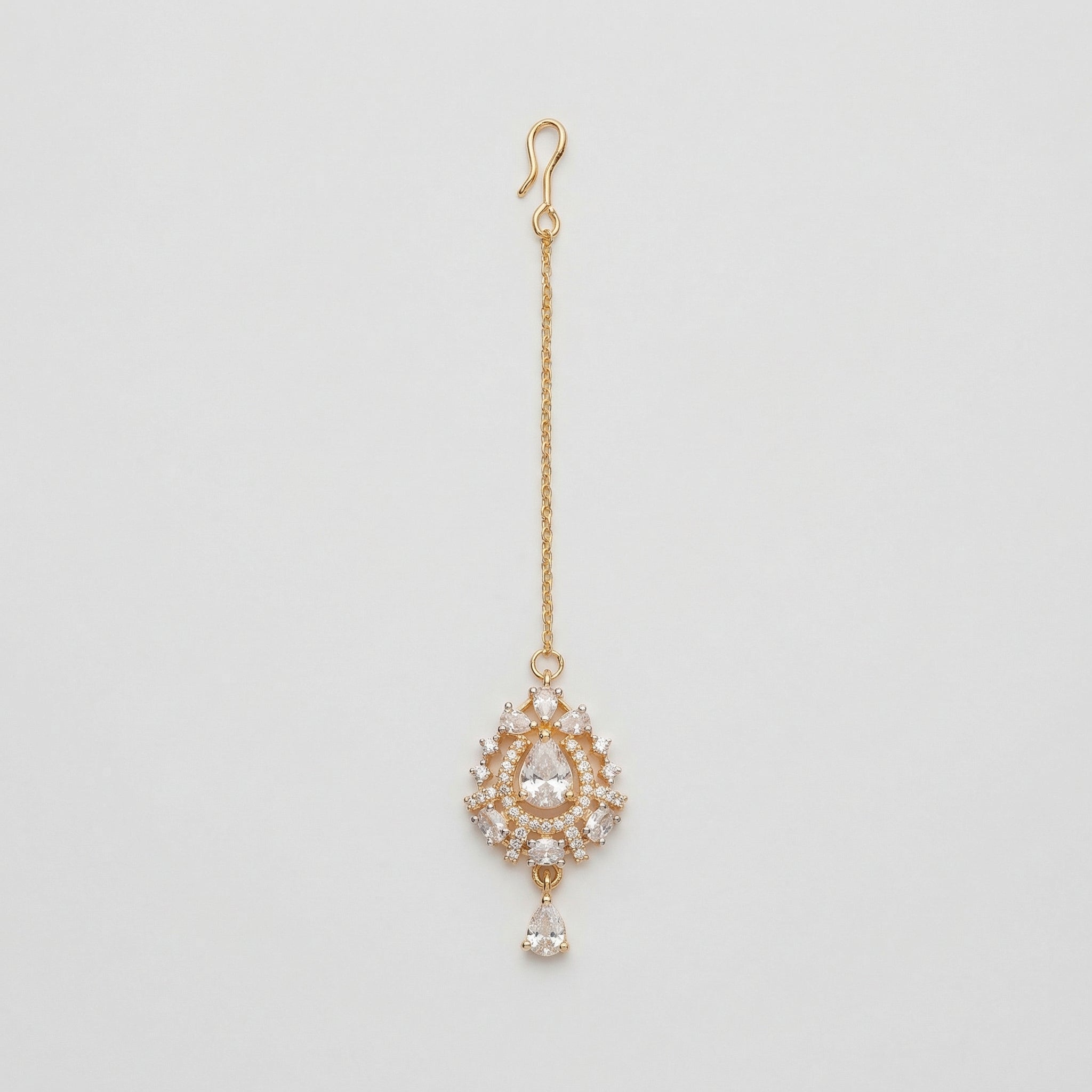 Riya Pear Tikka gold maang tikka with pear crystal halo pendant and teardrop drop on gray background