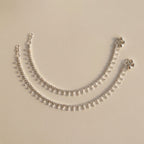 Sia Crystal Anklet pair of silver-tone payals with teardrop crystal dangles and bells
