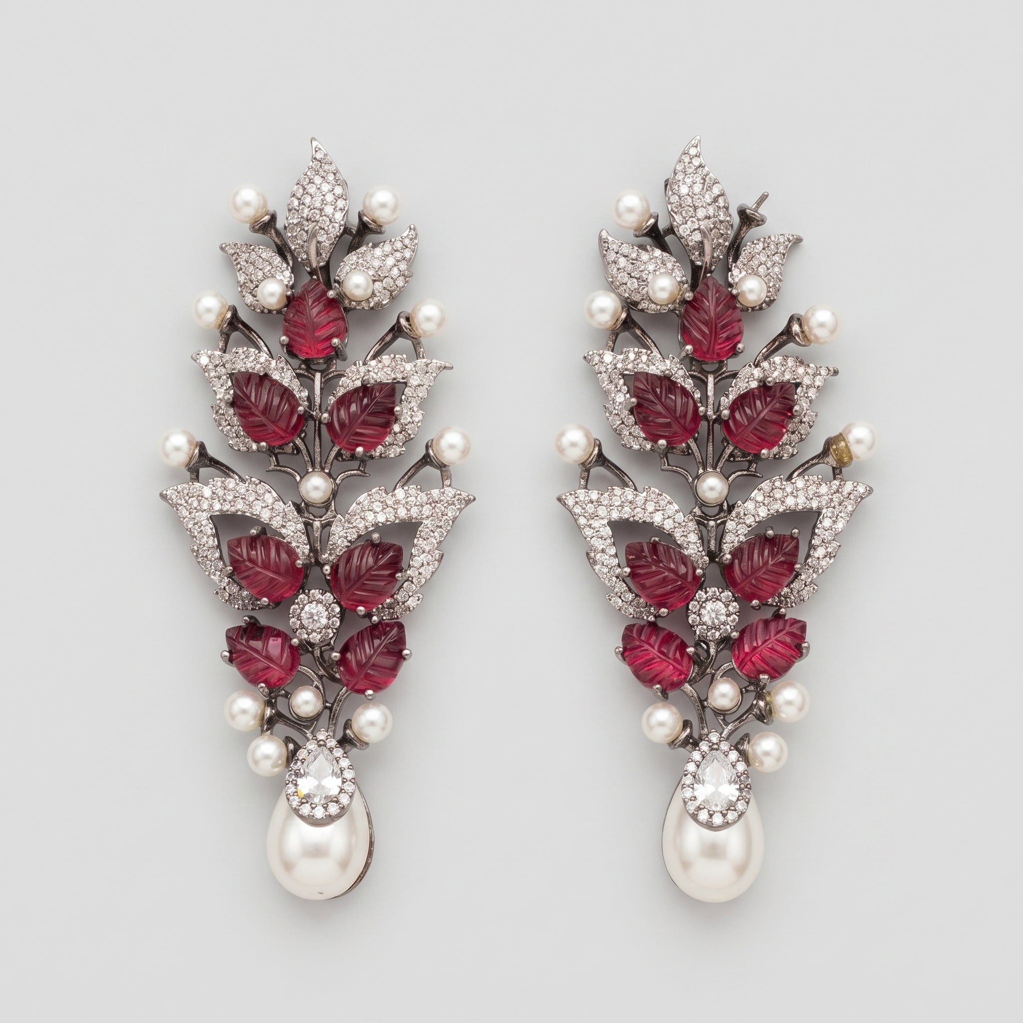Rani Ruby Earrings oxidized silver botanical drops with ruby leaves and pearl fringe on gray background