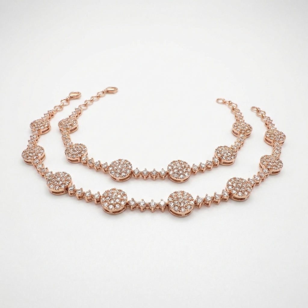 Sia Star Anklet pair of rose-gold-tone pavé disc payals on white background