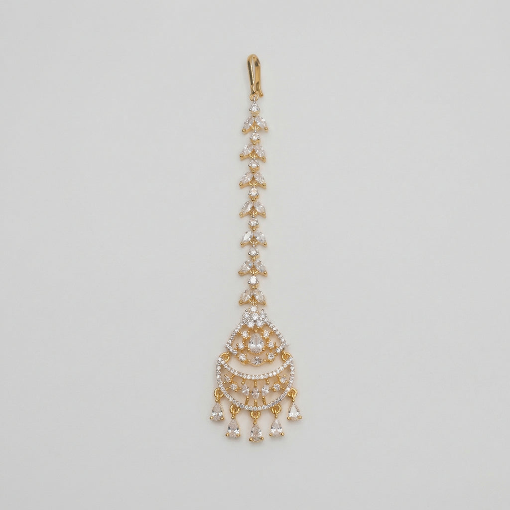 Kiara Dewdrop Tikka gold chandbali maang tikka with marquise crystal chain and teardrop dangles on gray background
