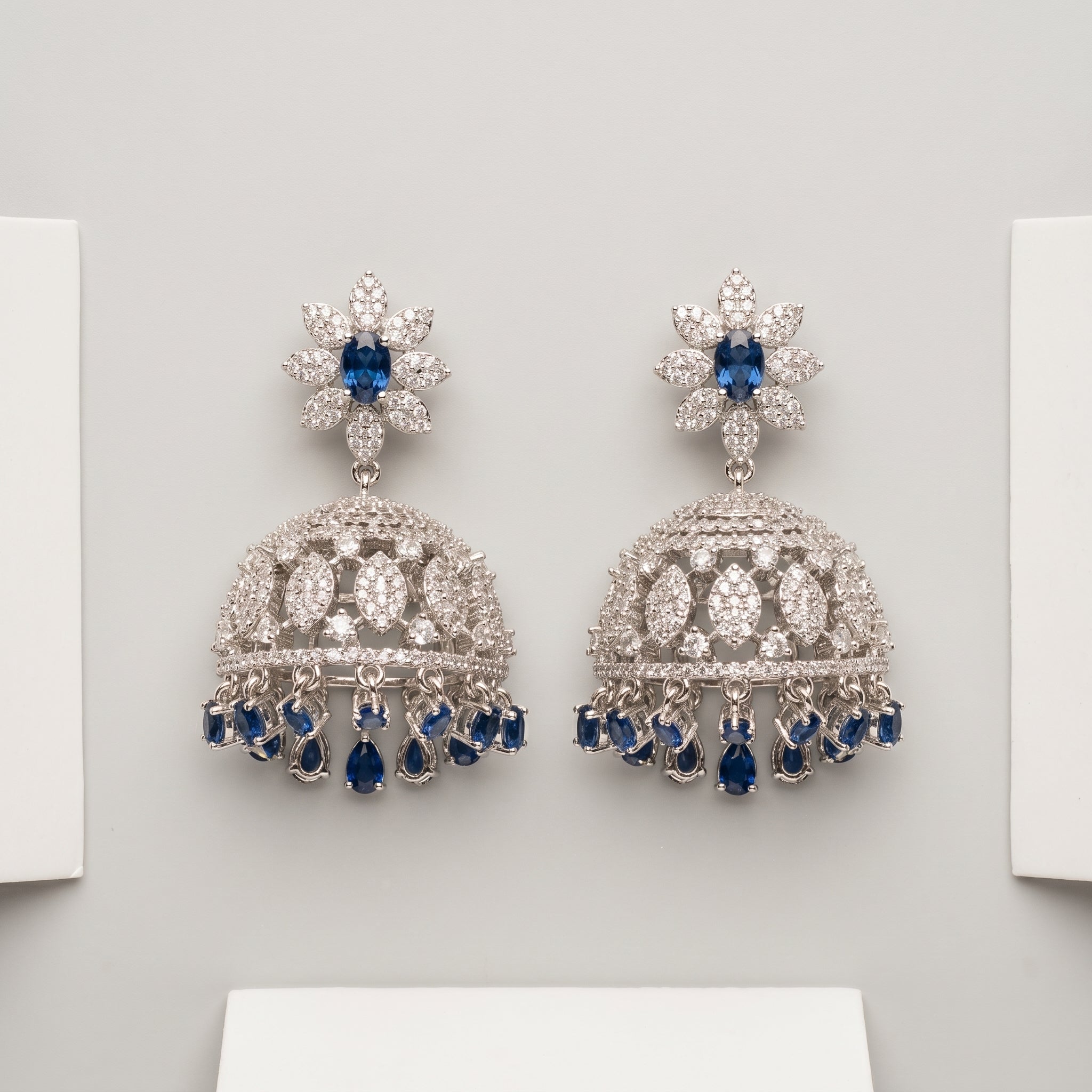 Neelam Jhumka Earrings rhodium jhumkas with blue pear fringe