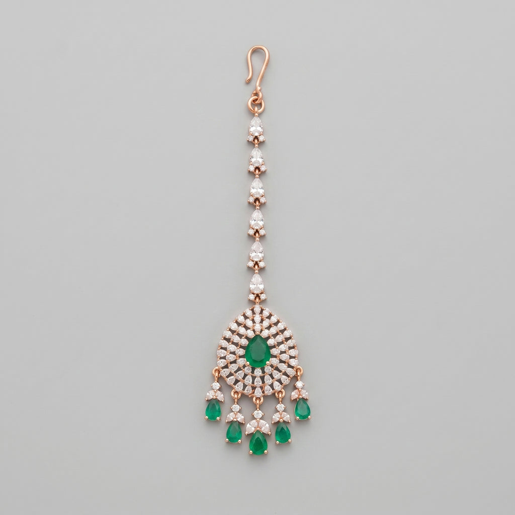 Panna Tikka rose-gold maang tikka with emerald green teardrop center
