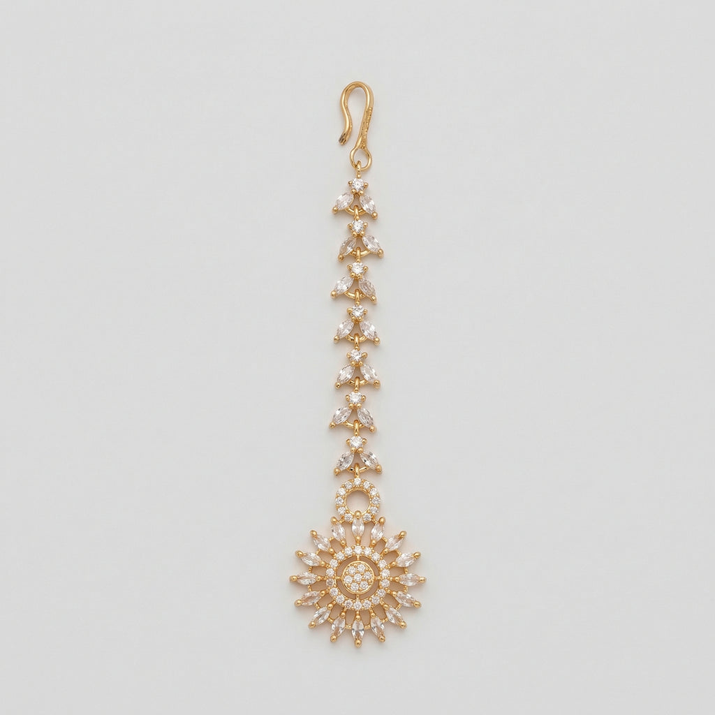 Kiran Tikka gold-tone marquise chain maang tikka with round sunburst crystal pendant on gray background