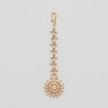 Kiran Tikka gold-tone marquise chain maang tikka with round sunburst crystal pendant on gray background
