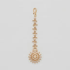 Kiran Tikka gold-tone marquise chain maang tikka with round sunburst crystal pendant on gray background