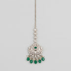 Noor Emerald Tikka silver maang tikka with green center stone and green teardrop bead fringe on gray background