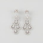 Noor Cascade Earrings rhodium-plated tiered crystal pavé chandelier fans on gray background