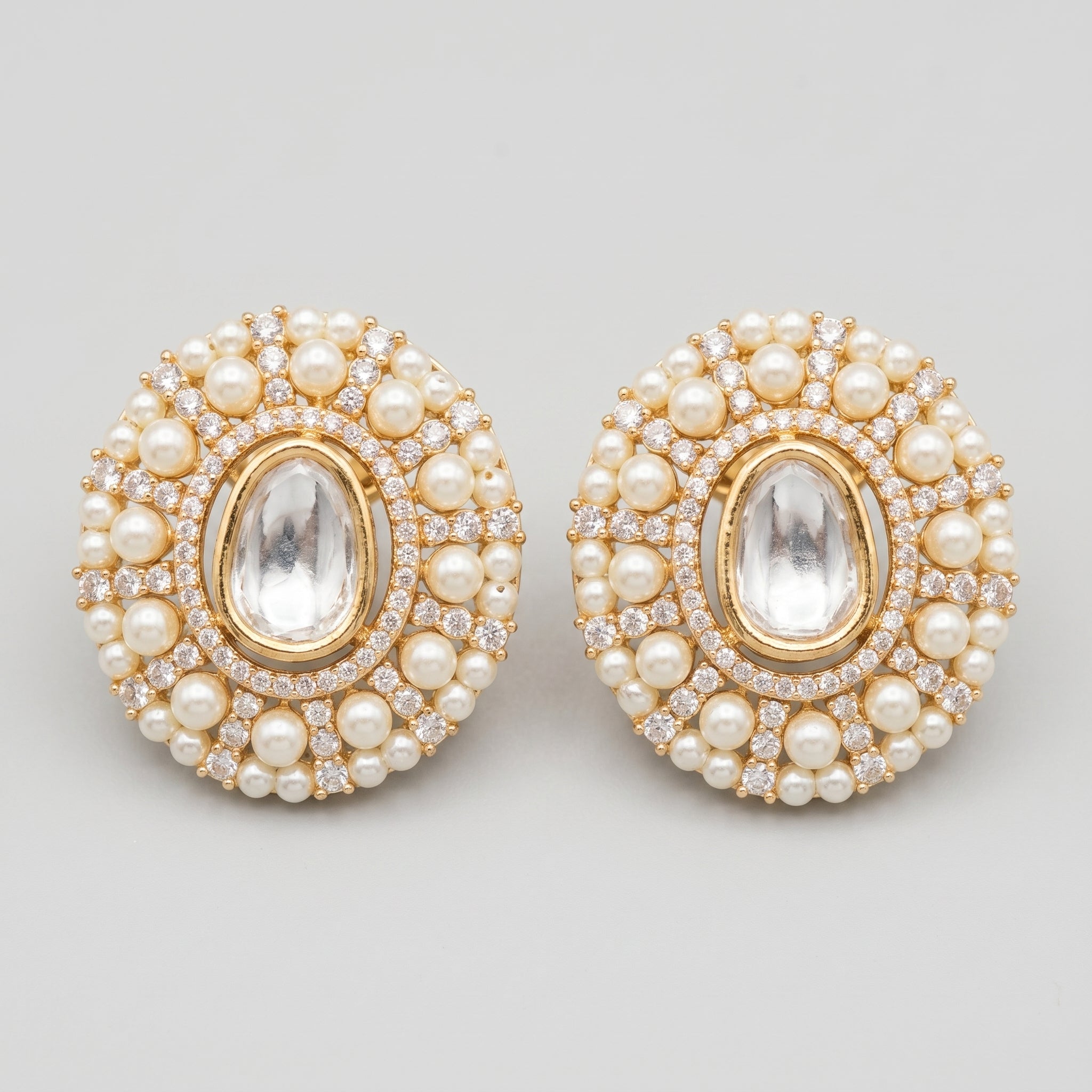 Kundan Pearl Earrings gold kundan studs with clear center and pearl crystal border on gray background