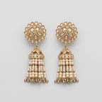 Gajra Pearl Earrings gold-tone kundan jhumka earrings with pearl tassel strands on gray background