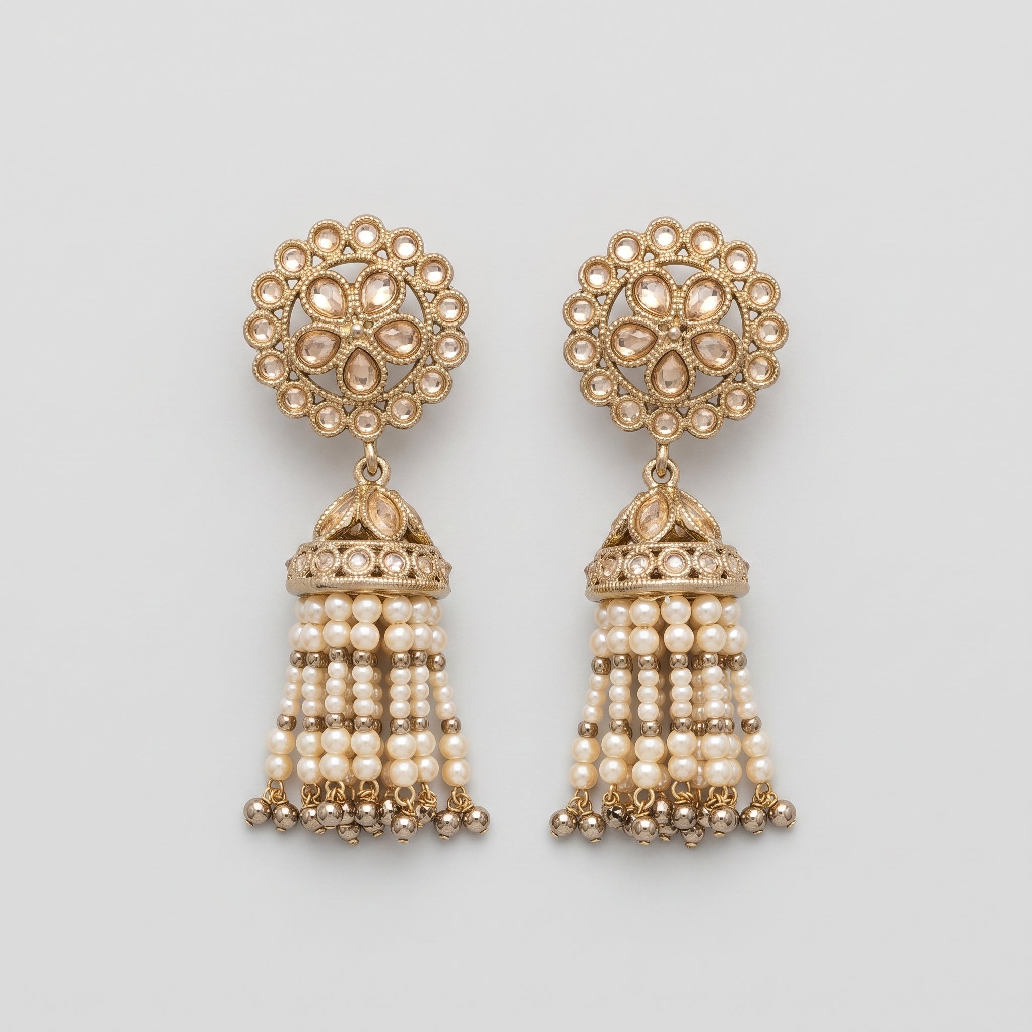 Gajra Pearl Earrings gold-tone kundan jhumka earrings with pearl tassel strands on gray background