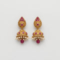Ruby Pearl Earrings gold jhumka drops with ruby stones and pearl fringe on gray background