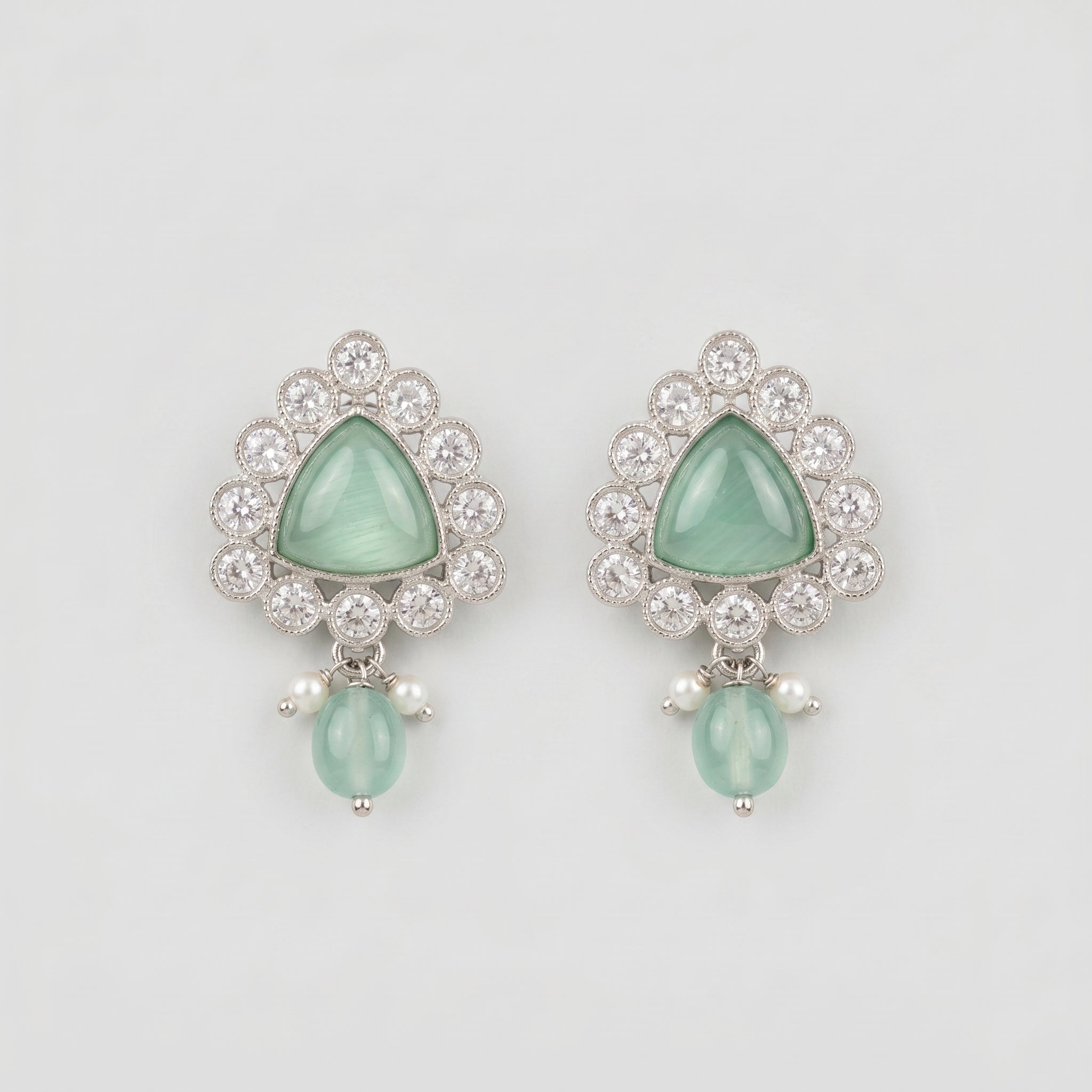 Rani Aqua Earrings rhodium-plated mint green triangular stud drops with pearl accents on gray background