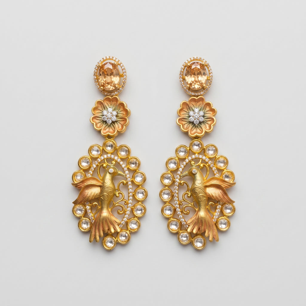 Hansini Drop Earrings matte gold-tone bird motif drop earrings on gray background