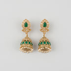 Panna Jhumka Earrings gold-tone emerald jhumkas with green teardrop stones and pearl fringe on gray background