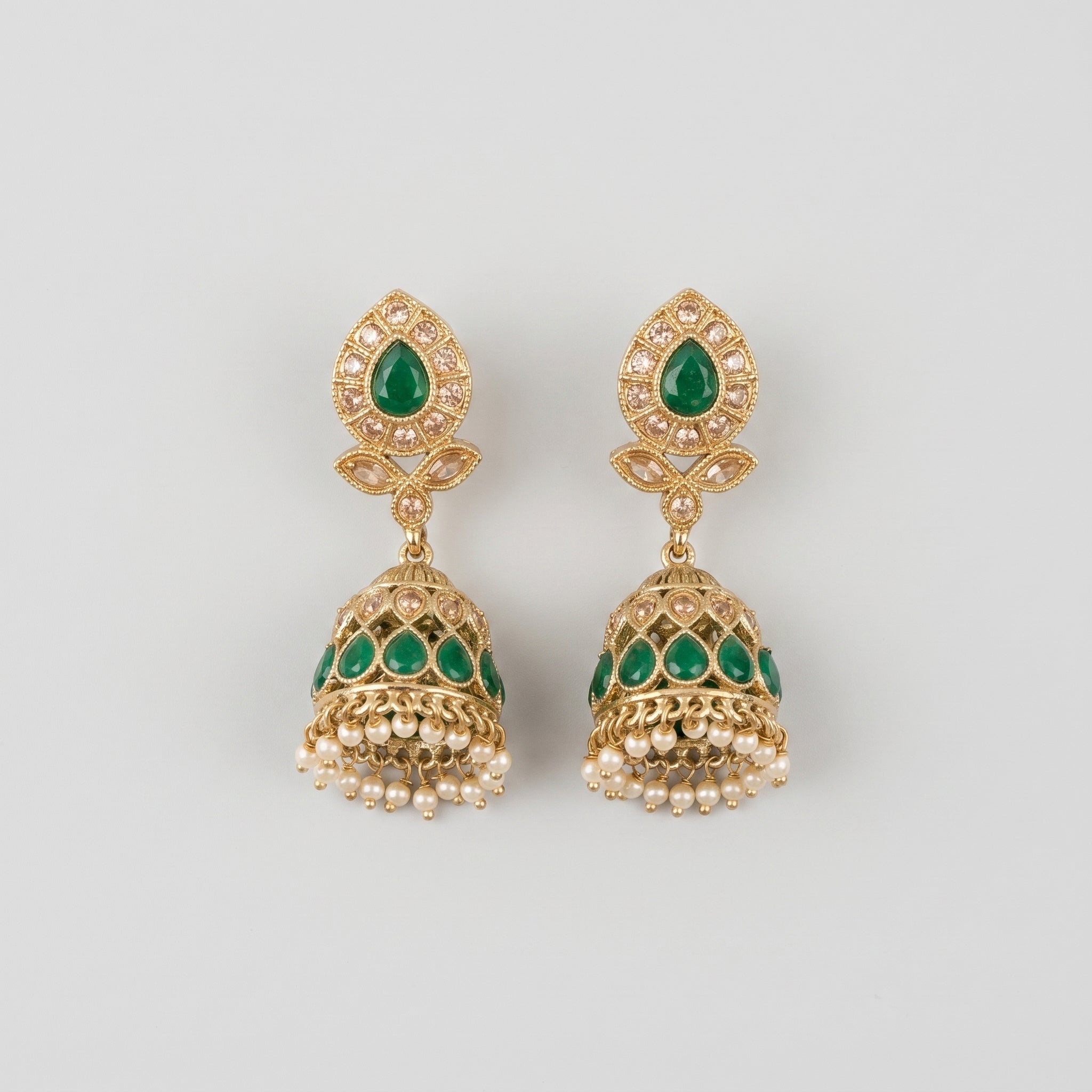 Panna Jhumka Earrings gold-tone emerald jhumkas with green teardrop stones and pearl fringe on gray background