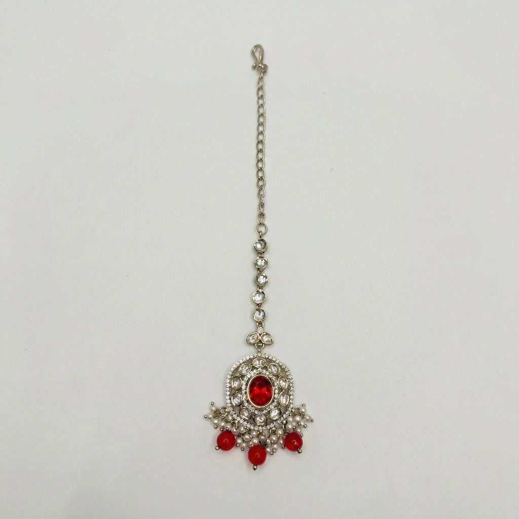 Ruby Bloom Tikka silver maang tikka with red oval center and red bead pearl fringe on white background