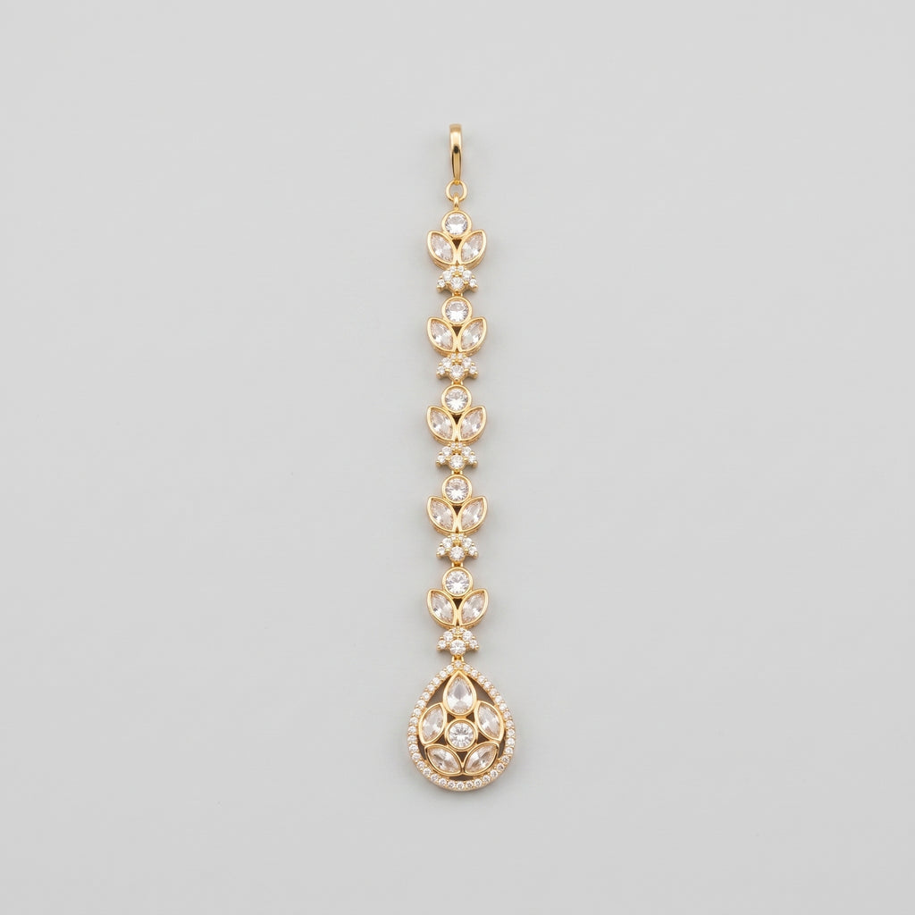 Kundan Crystal Tikka gold maang tikka with clear crystal chain and teardrop pendant on gray background