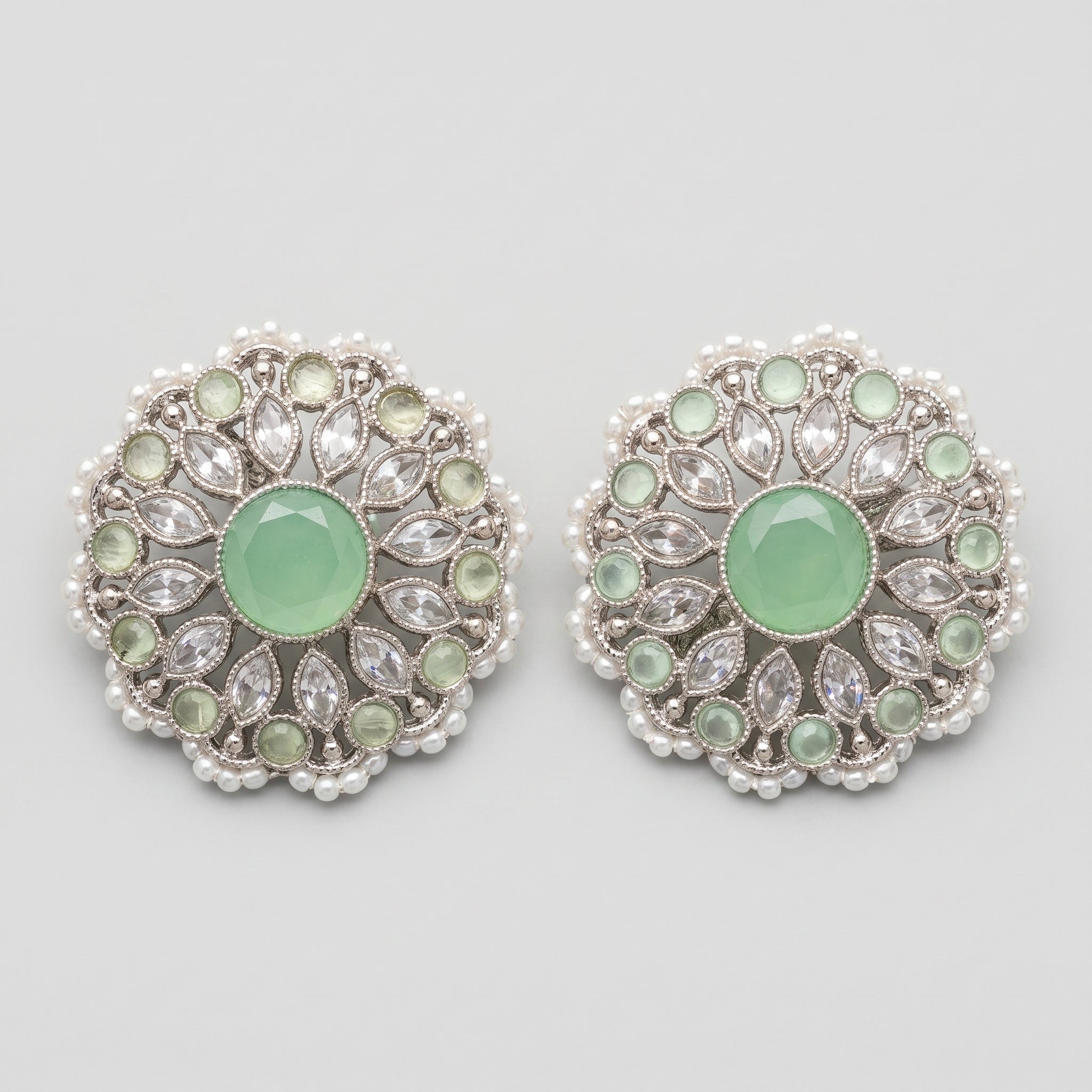 Mint Bloom Earrings silver circular studs with mint green center and pearl border on gray background