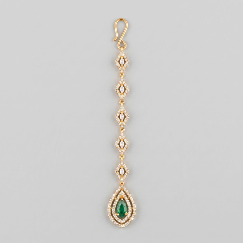 Priya Emerald Tikka gold-tone maang tikka with rhombus links and green teardrop pendant on gray background