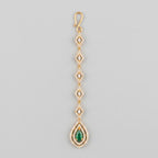 Priya Emerald Tikka gold-tone maang tikka with rhombus links and green teardrop pendant on gray background