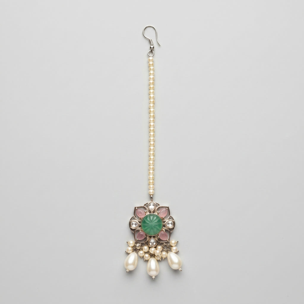 Firozi Pearl Tikka silver maang tikka with green center stone and pearl drops on gray background