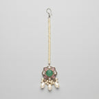 Firozi Pearl Tikka silver maang tikka with green center stone and pearl drops on gray background