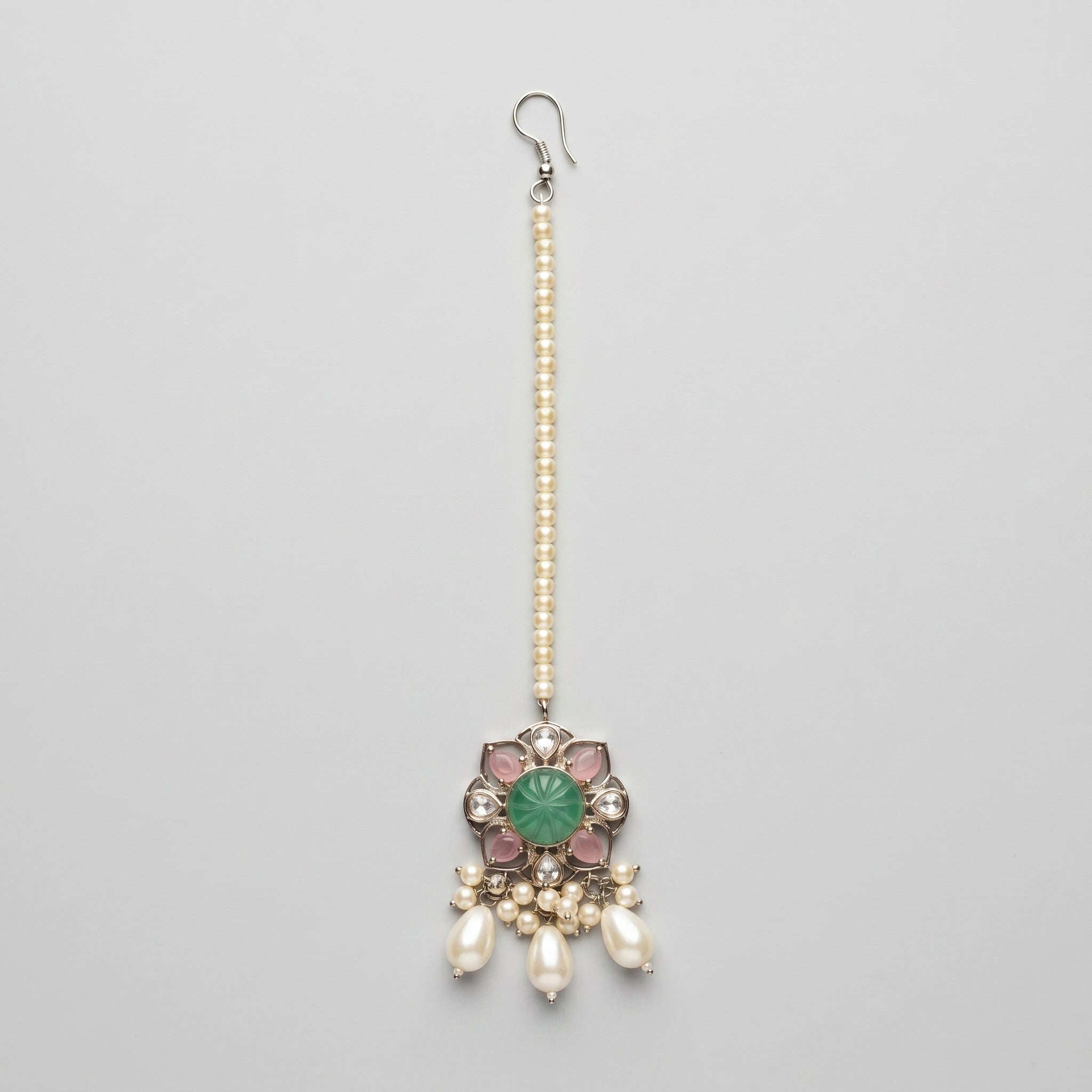 Firozi Pearl Tikka silver maang tikka with green center stone and pearl drops on gray background