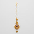 Padma Crimson Tikka antique gold maang tikka with crimson stones on gray background