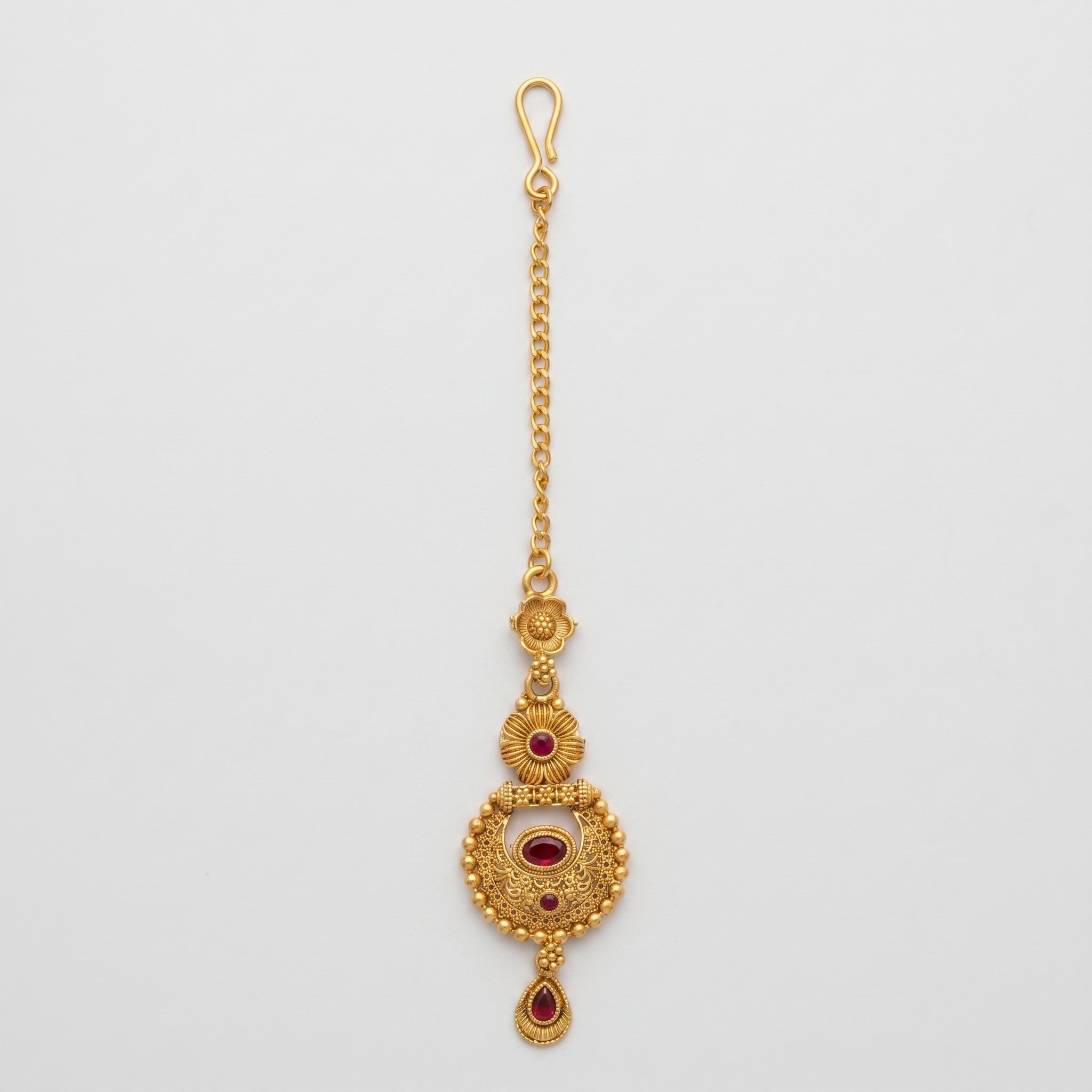 Padma Crimson Tikka antique gold maang tikka with crimson stones on gray background