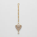 Golden Flora Tikka gold-tone floral heart maang tikka with teardrop chain on gray background