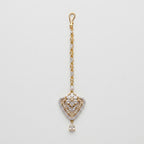 Golden Flora Tikka gold-tone floral heart maang tikka with teardrop chain on gray background
