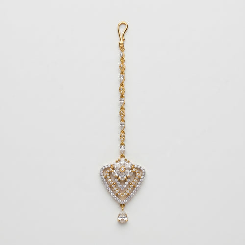 Golden Flora Tikka gold-tone floral heart maang tikka with teardrop chain on gray background