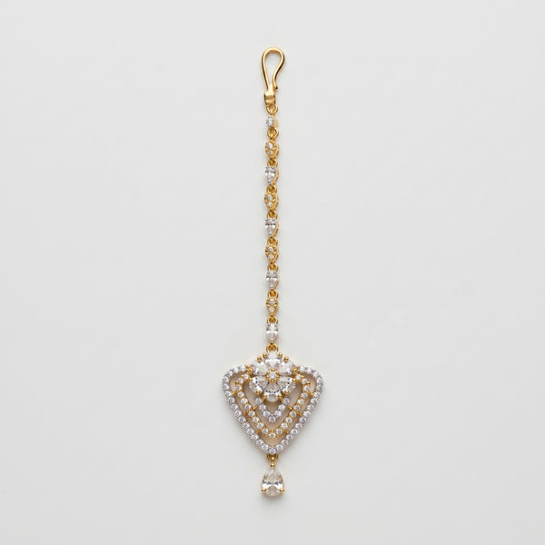 Golden Flora Tikka gold-tone floral heart maang tikka with teardrop chain on gray background