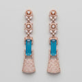 Rani Firoza Earrings rose gold-tone long drops with blue emerald-cut centers on gray background