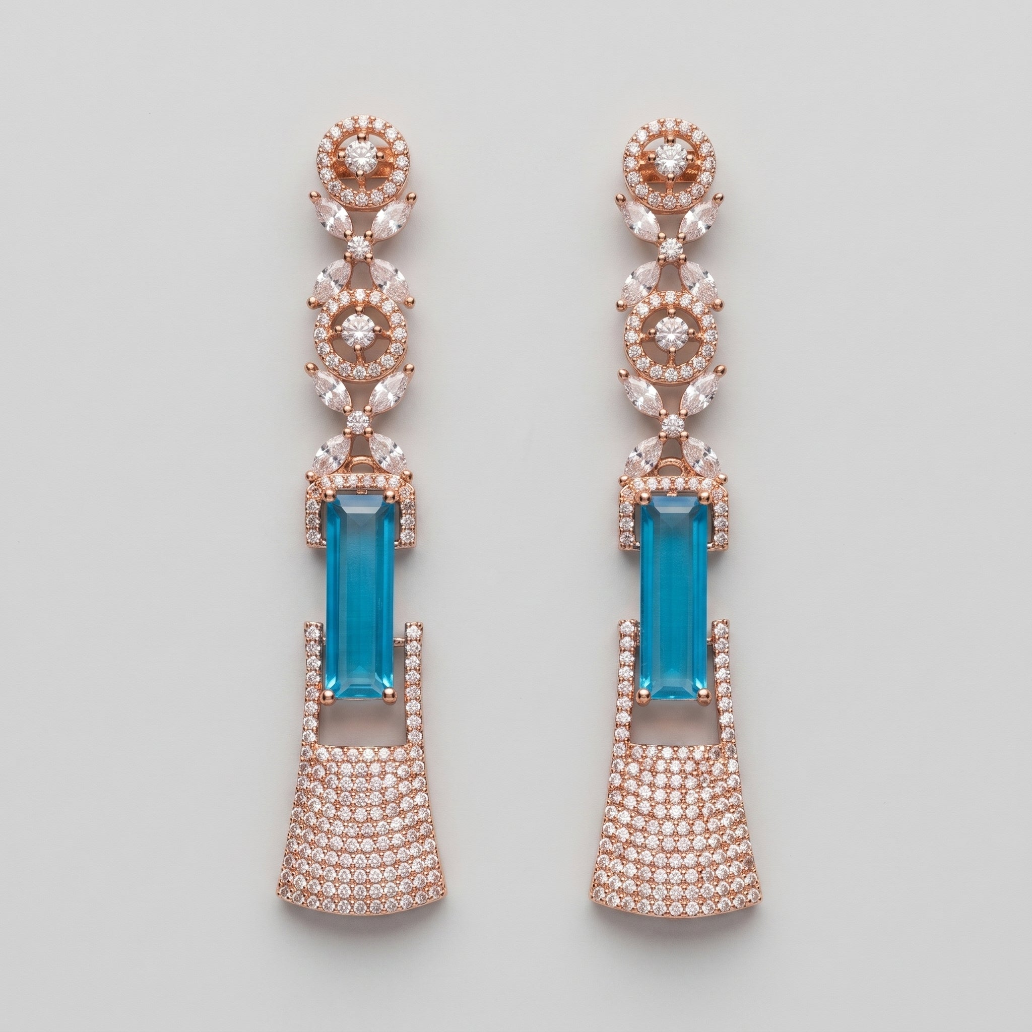 Rani Firoza Earrings rose gold-tone long drops with blue emerald-cut centers on gray background