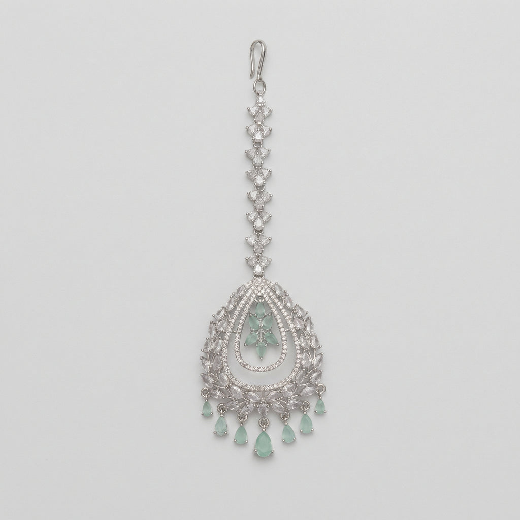 Zara Mint Tikka silver maang tikka with mint green center and teardrop dangles on gray background