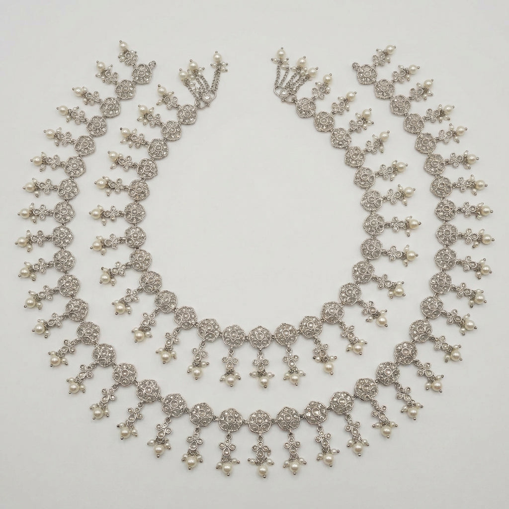 Sia Filigree Anklet pair of silver-tone filigree pearl payals arranged in a circle