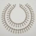 Sia Filigree Anklet pair of silver-tone filigree pearl payals arranged in a circle