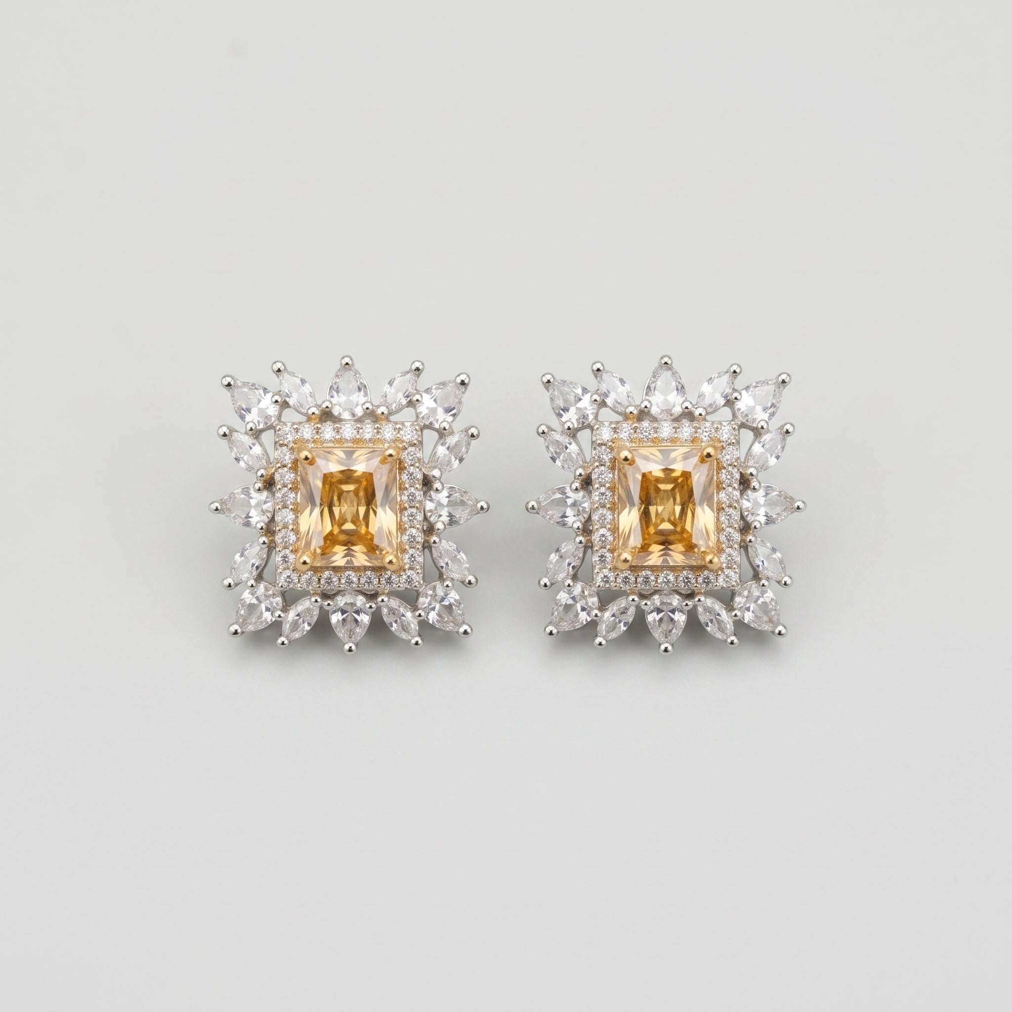 Citrine Square Earrings silver-tone square studs with golden citrine centers on gray background