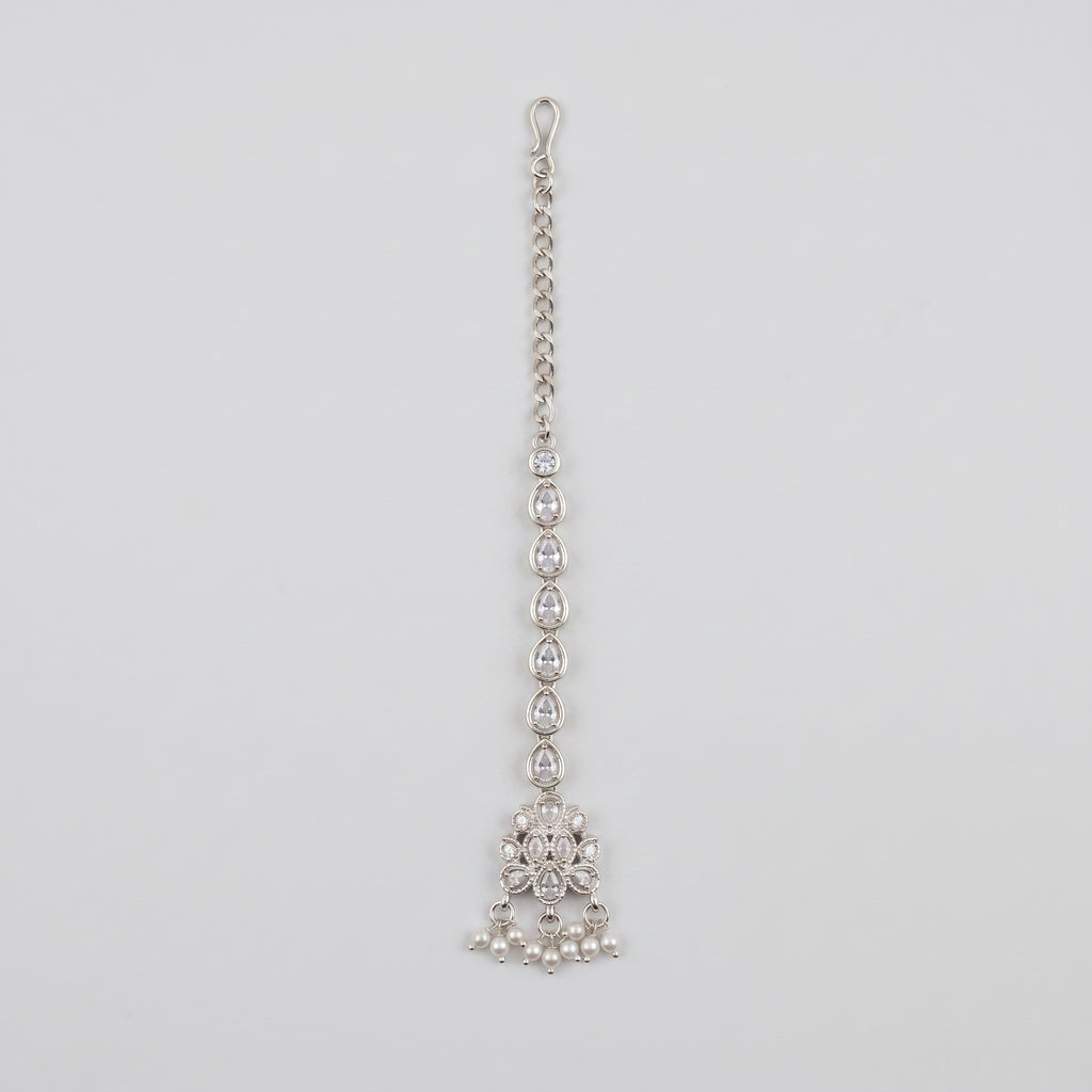 Zara Crystal Tikka silver-tone maang tikka with teardrop chain and pearl fringe on gray background